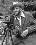 Ansel Easton Adams (February 20, 1902 – April 22, 1984) was an American photographer and environmentalist. His black-and-white landscape photographs of the American West, especially Yosemite National Park, have been widely reproduced on calendars, posters, and in books.<br/><br/>

With Fred Archer, Adams developed the Zone System as a way to determine proper exposure and adjust the contrast of the final print. The resulting clarity and depth characterized his photographs. Adams primarily used large-format cameras because their high resolution helped ensure sharpness in his images.<br/><br/>

Adams was distressed by the Japanese American Internment that occurred after the Pearl Harbor attack. He requested permission to visit the Manzanar War Relocation Center in the Owens Valley, at the foot of Mount Williamson.